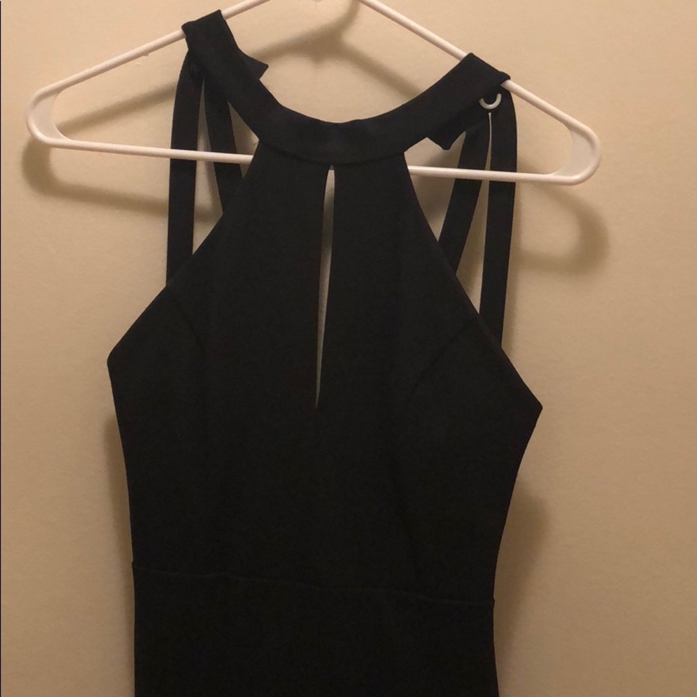 Black cocktail dress, unique back straps.